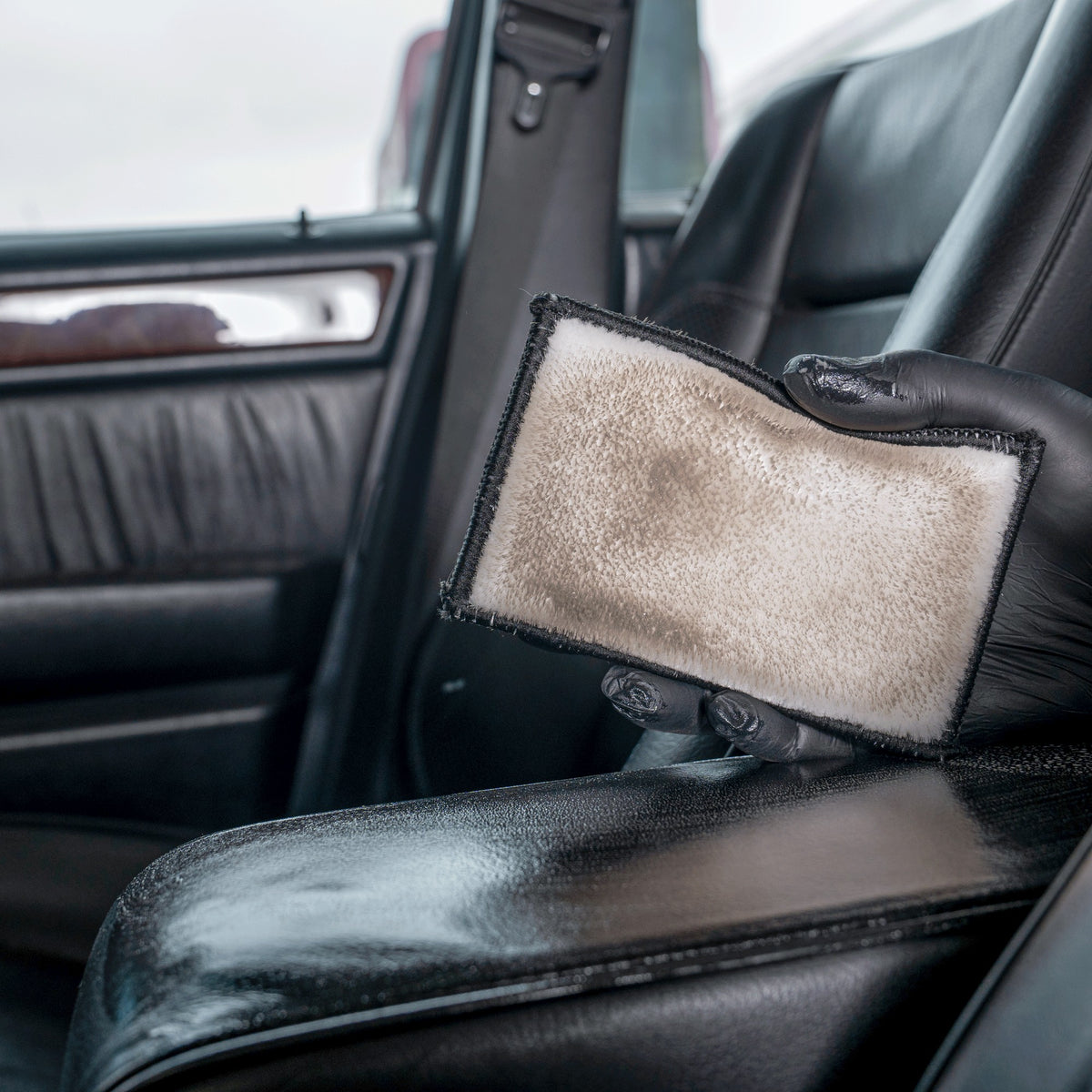 Detailing1 COLOURLOCK Smooth Leather Care Set — the pad shows the dirt lifted from the armrest